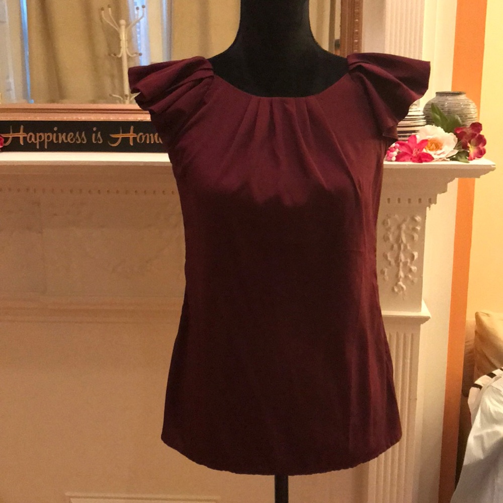 Capped ruffle sleeve top with pleat detail